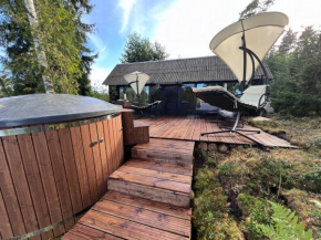 Black house in the forest with Hot Tube and Home theater for movies